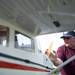 Ann Arbor resident Glen Mcintosh starts his one-third scale Cessna 182 before it takes flight at the Flying Pilgrims Radio Control Club event on Sunday. Mcintosh has been flying planes for more than 40 years. Daniel Brenner I AnnArbor.com